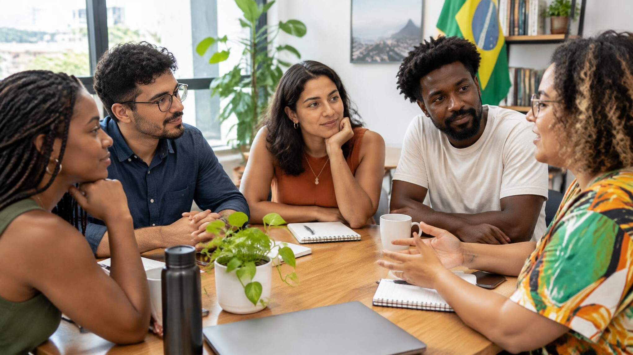 Group of people discussing around a meeting table
