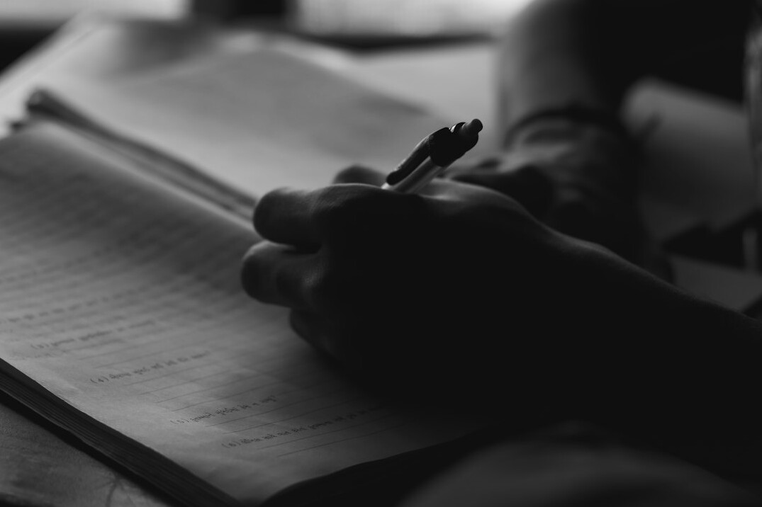 person writing goals